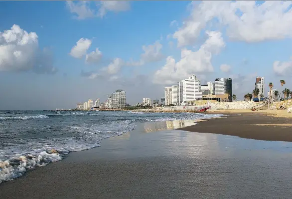  ?? PNG/ FILES ?? Whether you watch surfers take on the waves or just soak in a stroll on a palm-lined promenade, spending a day by the beach is a great way to enjoy Israel’s Tel Aviv.