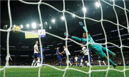  ??  ?? Paulo Gazzaniga and the Spurs defenders can only watch as Willian opens the scoring for Chelseaon Sunday. Photograph: Eddie Keogh/ Reuters