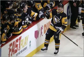  ?? GENE J. PUSKAR - THE ASSOCIATED PRESS ?? Pittsburgh Penguins’ Sidney Crosby (87) returns to the bench after his goal during the third period of an NHL hockey game against the Minnesota Wild in Pittsburgh, Tuesday, Jan. 14, 2020.