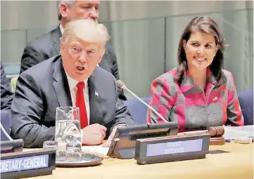  ?? — Reuters photo ?? Trump speaks as United States UN Ambassador Nikki Haley looks on at the United Nations Global Call to Action on the World Drug Problem during the 73rd UN General Assembly in New York.