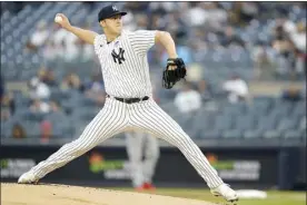  ?? AP photo ?? New York Yankees’ Jameson Taillon pitches during the first inning in the second game of the team’s doublehead­er against the Los Angeles Angels on Thursday in New York.