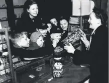 ??  ?? 0 Children from Moray House School rush to an Edinburgh sweet shop after sweet rationing ended on this day in 1953
