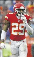  ?? AP AND GETTY FILE IMAGES ?? The Vikings declined to pick up running back Adrian Peterson’s $18 million option; the Redskins gave Kirk Cousins (center) the franchise tag for the second year in a row, and the Chiefs and Eric Berry agreed to a six-year, $78 million deal.