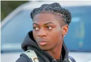  ?? AP PHOTO/MICHAEL WYKE ?? Darryl George, a 17-year-old junior, is shown Sept. 18 before walking across the street to go into Barbers Hill High School after serving a five-day in-school suspension for not cutting his hair, in Mont Belvieu, Texas.