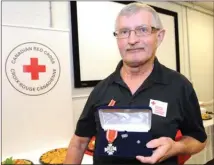  ?? GARY NYLANDER/The Daily Courier ?? Cor Zandbergen of Vernon holds his Order of Red Cross medal at the Canadian Red Cross office in Kelowna on Tuesday.