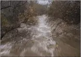  ?? NIC COURY — THE ASSOCIATED PRESS FILE ?? The Carmel River in Carmel Valley flows heavily after recent rains on Jan. 9.