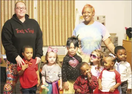  ?? Brodie Johnson • Times-Herald ?? Teach and Tend Daycare in Forrest City held activities for their students today for what they call a “Twos-Day” event sicne today’s date is 2-22-22. Childcare Workers Anna Mathes, far left, and Teva Hamilton are pictured with some students who dressed up in tutus and ties for their “Twos-Day” event.