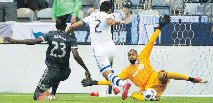  ?? GERRY KAHRMANN/PNG ?? Kei Kamara of the Whitecaps directs a shot at Impact goalie Clement Diop during Canadian Championsh­ip semifinal action on Wednesday night.