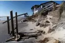  ?? ?? This picture shows a coastal home after part of its back garden and sand was washed away during the storm surge caused by Cyclone Gabrielle in Waihi Beach in the Bay of Plenty. Photograph: Marty Melville/AFP/Getty Images