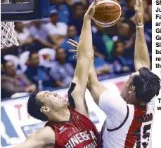  ??  ?? SMB’s June Mar Fajardo (right) and Barangay Ginebra’s Greg Slaughter battle for the rebound in their game Sunday at the Smart Araneta Coliseum. The Beermen won, 107-103. PBA IMAGES