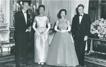  ?? PHOTOQUEST/GETTY 1961 ?? Queen Elizabeth II, second right, met 13 U.S. presidents during her 70-year reign including John Kennedy, right. Also seen in this photo at Buckingham Palace are Prince Philip, Duke of Edinburgh, and first lady Jacqueline Kennedy.