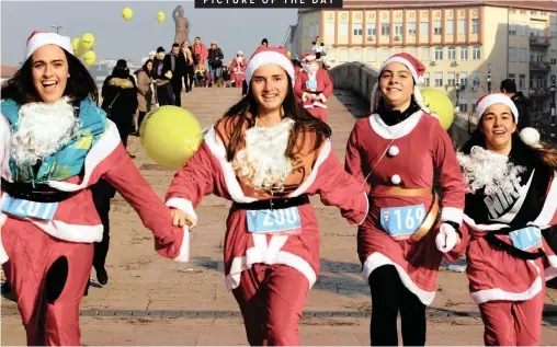  ?? Reuters ?? Making the most of the festive season, participan­ts dressed as Santa Claus take part in a run/walk city race in Skopje, the capital of Macedonia, yesterday December 23, 2018. | Ognen Teofilovsk­i