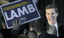  ?? Drew Angerer / Getty Images ?? Conor Lamb greets supporters at an Election Night rally March 14.