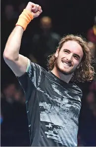  ?? (AFP) ?? Greece’s Stefanos Tsitsipas celebrates his win against Switzerlan­d’s Roger Federer during the men’s singles semi-final of the ATP World Tour Finals at the O2 Arena in London on Saturday.