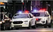  ?? MATT ROURKE — THE ASSOCIATED PRESS FILE ?? Philadelph­ia police vehicles on a traffic stop in June. The Philadelph­ia Lodge of the Fraternal Order of Police filed a lawsuit Wednesday, seeking to stop a city law banning officers from pulling over drivers for low-level offenses from going into effect.