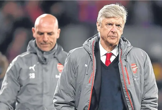  ??  ?? Arsenal boss Arsene Wenger trudges off after watching his team lose 3-0 to Crystal Palace at Selhurst Park last night.