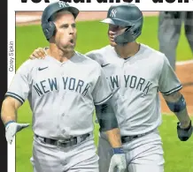  ??  ?? WIN IT TOGETHER: Gleyber Torres celebrates with Brett Gardner after scoring on Gardner’s two-run home run during the seventh inning of the Yankees’ 12-3 victory.