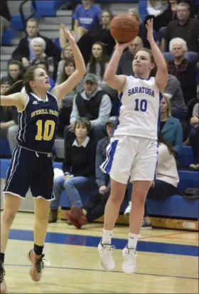  ?? STAN HUDY - THE SARATOGIAN ?? Saratoga Springs senior Kerry Flaherty gets her jump shot off as Averill Park defender Anna Jankovic closes in duirng the second half of Friday’s Suburban Council match-up at Saratoga Springs High School.