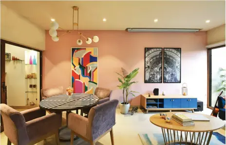  ??  ?? PINK PERFECTION The black and white dining table contrasts well with the pink walls and colourful artwork (above); the master bedroom (below)