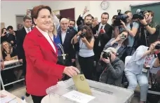  ?? AFP, EPA ?? Top, Muharrem Ince after casting his ballot, and above, Meral Aksener, leader of the Iyi Party, votes