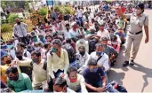  ?? — PTI ?? Migrant workers stand in a queue to board an outstation train to go their native place at Panvel Railway Station in Navi Mumbai on Friday.