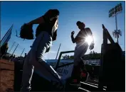  ?? RANDY VAZQUEZ — BAY AREA NEWS GROUP FILE ?? The Giants' Logan Webb, left, walks down to the field with first base coach Antoan Richardson, right, during spring training at Scottsdale Stadium in, Ariz., on Feb. 14, 2020.