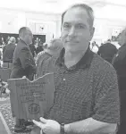  ?? SUBMITTED PHOTO ?? Watkins Memorial varsity football coach Jeff Severino displays a plaque after the Ohio High School Football Coaches Associatio­n named his team an academic all-ohio team. The team had a grade-point average of 3.60.