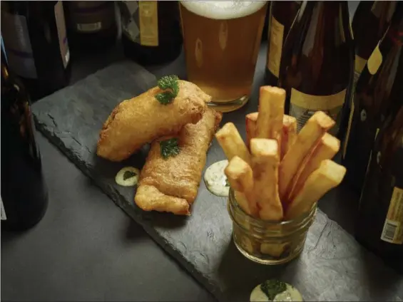  ?? PHIL MANSFIELD — THE CULINARY INSTITUTE OF AMERICA VIA AP ?? Fish and chips are shown.