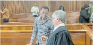  ?? Picture: DEVON KOEN ?? HAVING A DISCUSSION: Convicted murderer Mvuzo Jack speaks to defence advocate Jodine Coertzen in the Port Elizabeth High Court