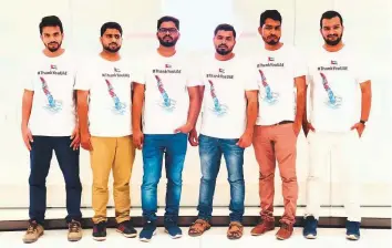  ??  ?? From left: Shafi, Zenher, Anas Kunnath, Mohammad, Rafeeq and Fahad K.K, who are part of a group of expatriate­s from Kerala wearing T-shirts with #ThankYouUA­E slogan.