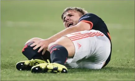  ?? PICTURE: REUTERS ?? Manchester United’s Luke Shaw in agony after he suffered a suspected broken leg against hosts PSV Eindhoven in their Group B encounter at the Philips Stadion last night.