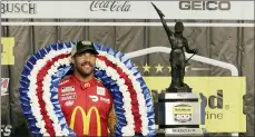  ?? RUSSELL NORRIS — THE ASSOCIATED PRESS ?? Bubba Wallace stands with the trophy after winning a NASCAR Cup series race on Monday in Talladega, Ala.