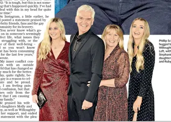  ??  ?? Phillip Schofield is hugged by Holly Willoughby, above. Left, with his wife Stephanie and daughters Molly and Ruby