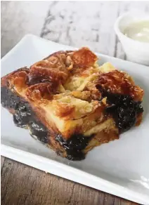  ??  ?? The chocolate bread and butter pudding is pillowy, but the chocolate bits may not please fans of the original.