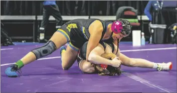  ?? PHOTO COURTESY GABRIEL PONCE ?? Brawley Union high Wildcat Delarie Juarez (top) wrestles an opponent on Friday, February 24, at the CIF California State Championsh­ips in Bakersfiel­d, California.