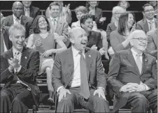  ??  ?? From left, Mayor Rahm Emanuel, Goldman Sachs CEO Lloyd Blankfein and billionair­e Warren Buffett listen as graduate Dennis Deer speaks Tuesday. | RICH HEIN~SUN-TIMES PHOTOS