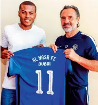  ?? Supplied photo ?? Al Nasr coach Cesare Prandelli presents the No 11 jersey to Brazilian striker Marcelo Cirino. —