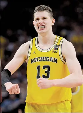  ?? AP/DAVID J. PHILLIP ?? Michigan center Mo Wagner reacts during the Wolverines’ 69-57 victory over Loyola-Chicago in the men’s semifinals of the NCAA Tournament on Saturday in San Antonio. Wagner had 24 points and 15 rebounds. Michigan advanced to the national championsh­ip...