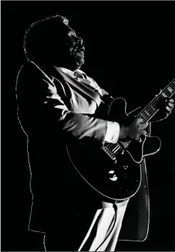  ?? (Special to the Democrat-Gazette/Art Meripol) ?? Art Meripol shot this backlit photo of B.B. King playing “Lucille,” his trusty Gibson. “That’s one of my absolute favorites because it was something no one else had shot,” Meripol says. “It was really different.”