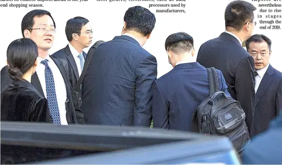  ?? AFP ?? MEMBERS of the Chinese delegation wait to leave after deputy-level US-China trade talks in Washington, DC.