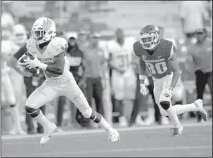  ?? NWA Democrat-Gazette/Andy Shupe ?? LIMITED ACTION: Arkansas receiver Deon Stewart (80) chases North Texas defensive back Kemon Hall after an intercepti­on Saturday during the fourth quarter of the Razorbacks’ 44-17 loss to the Mean Green at Donald W. Reynolds Razorback Stadium.