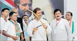  ?? PTI ?? Congress vicepresid­ent Rahul Gandhi after being presented with a bow and an arrow during his public meeting at Devghad Bariya village of Dahod district on Wednesday.