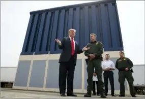  ?? AP PHOTO/EVAN VUCCI, FILE ?? In this March 13, 2018, file photo, President Donald Trump talks with reporters as he reviews border wall prototypes in San Diego. California’s attorney general filed a lawsuit Monday against Trump’s emergency declaratio­n to fund a wall on the U.S.-Mexico border. Xavier Becerra released a statement Monday saying 16 states — including California — allege the Trump administra­tion’s action violates the Constituti­on.