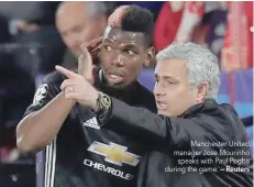  ?? — Reuters ?? Manchester United manager Jose Mourinho speaks with Paul Pogba during the game.