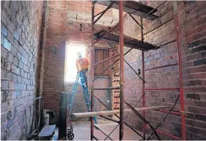  ?? AMY BETH BENNETT/STAFF PHOTOGRAPH­ER ?? Work continues in what will be the elevator shaft inside the circa 1927 former Boynton High site.