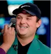  ??  ?? Masters golf champion Patrick Reed gets some make-up before a CNBC television interview.