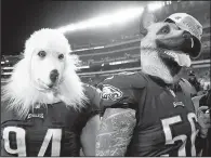  ?? AP/PATRICK SEMANSKY ?? Philadelph­ia Eagles teammates Beau Allen (left) and Chris Long celebrate Sunday’s NFC Championsh­ip Game victory over the Minnesota Vikings. Las Vegas oddsmakers have installed the Eagles as 6-point underdogs to the New England Patriots in the Super...