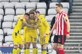  ??  ?? ■ Bristol Rovers players celebrate scoring the first goal during the Sky Bet League