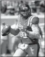  ?? AP/ROGELIO V. SOLIS ?? Mississipp­i quarterbac­k Chad Kelly threw for 282 yards and two touchdowns to lead the Rebels past Georgia 45-14, stopping a 10-game losing streak in the series.