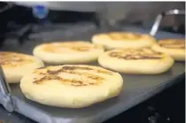  ?? AMY DREW THOMPSON/ORLANDO SENTINEL ?? Freshmade arepas are a new menu add. Paredes says customers have gone wild for them.